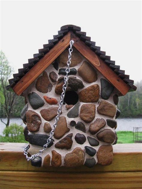 bird house made out of metal can and funnel|stone birdhouse exterior.